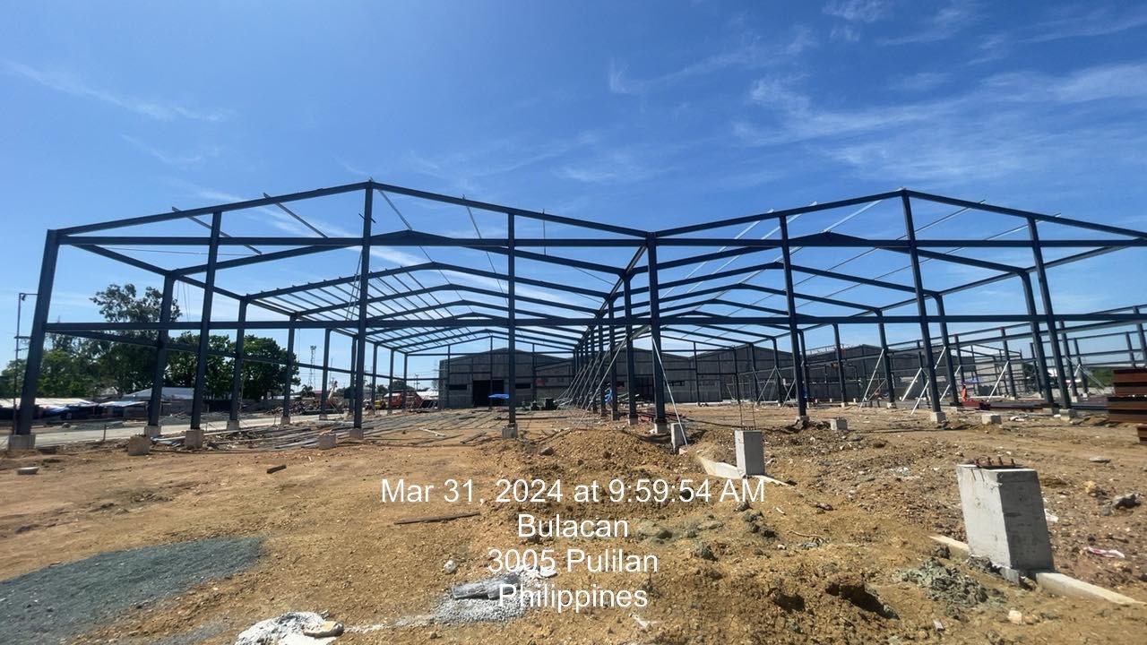 Structural steel frame of a warehouse under construction.